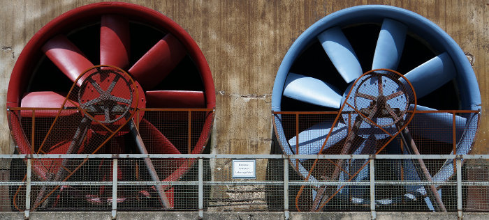 Two Industrial Air Handling Fans Painted Red and Blue